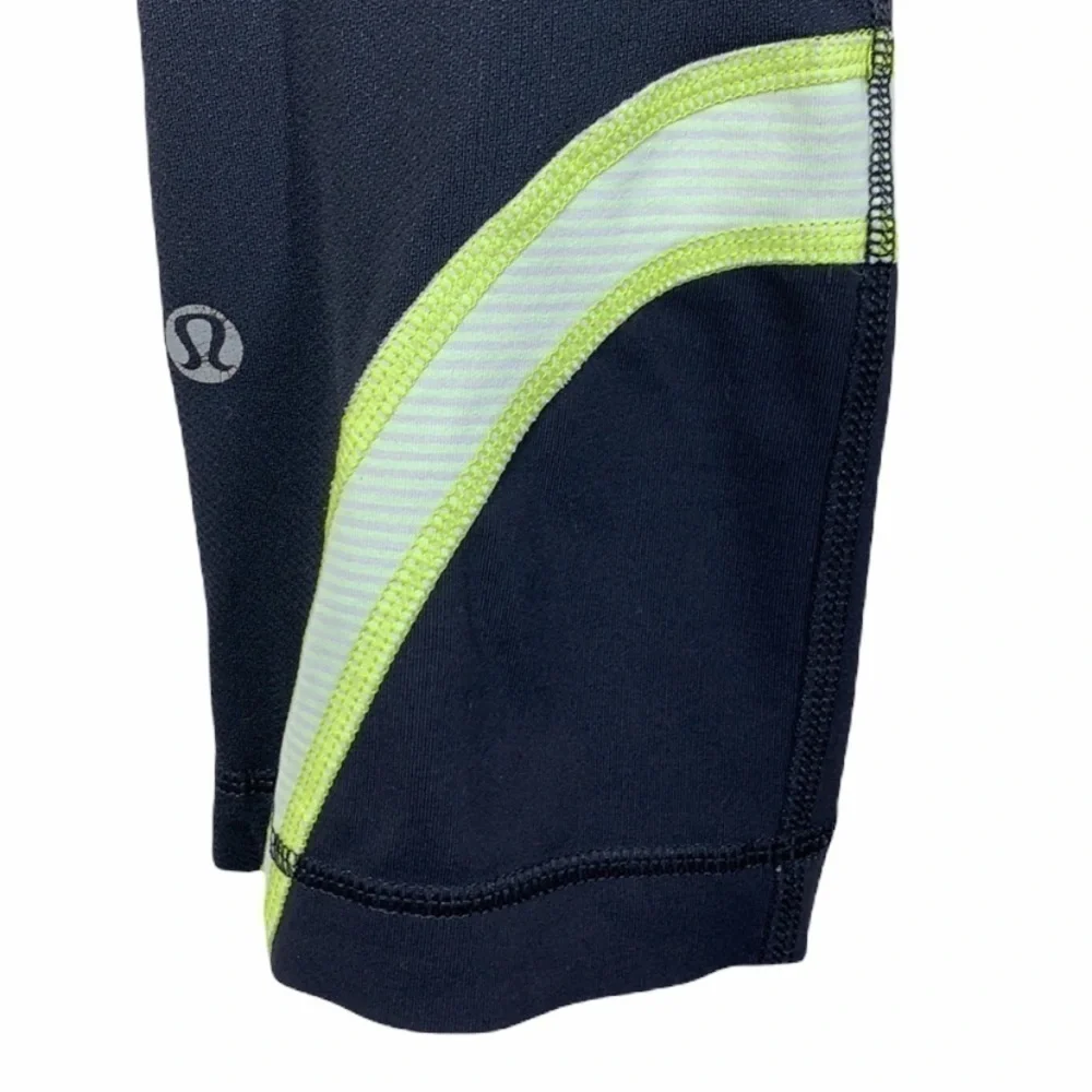 Lululemon black and yellow skull soul cycle crops